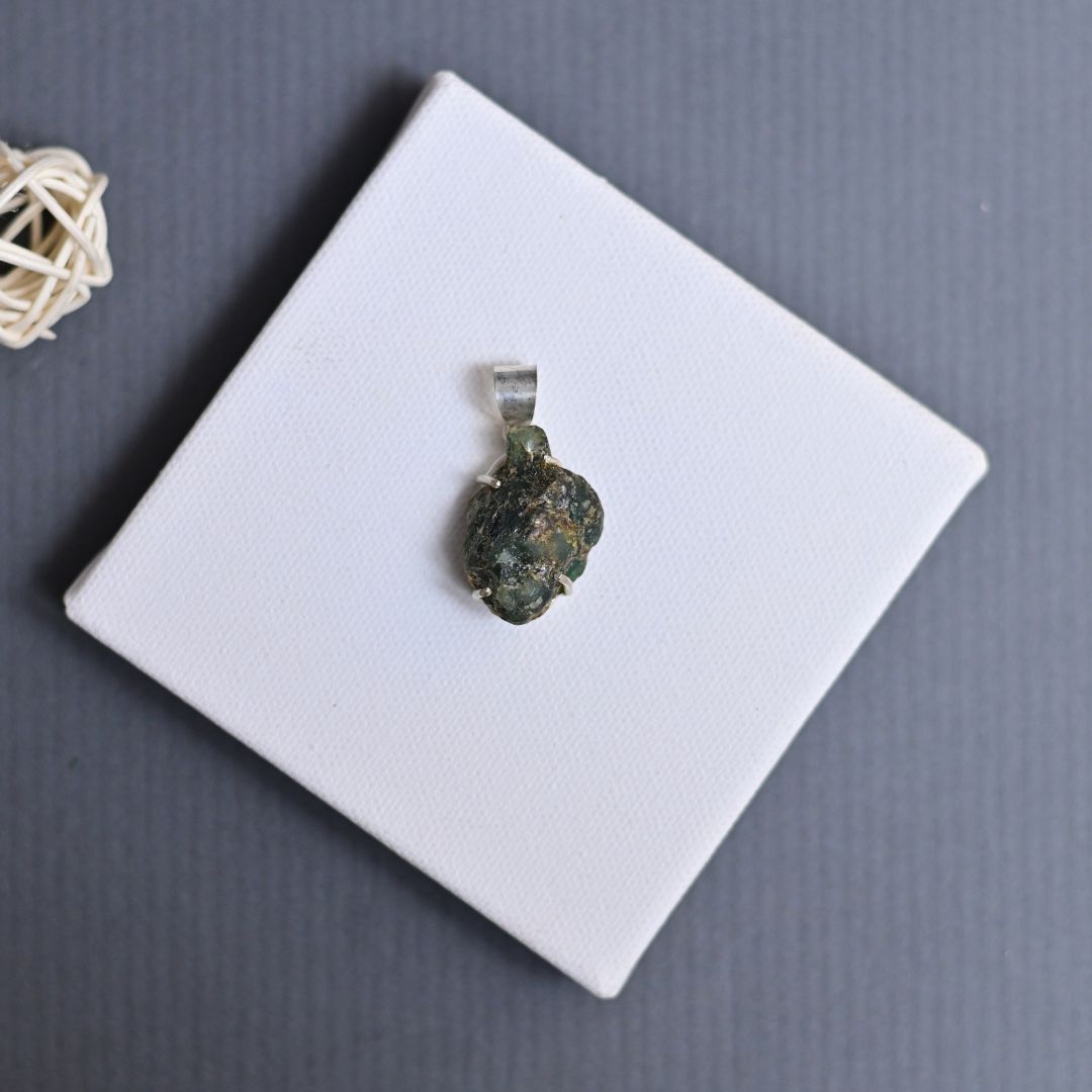 Raw emerald silver pendant