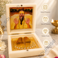 Shree Premanand Ji Maharaj Golden Paduka with Photo Frame Box – Premium Spiritual Showpiece for Home Temple, Office & Pooja Room (3x3 Inch)