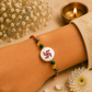 Money Magnet Swastik Rakhi – Green Jade, Citrine, Pyrite & Mother of Pearl Rakhi for Prosperity, Protection & Positive Energy